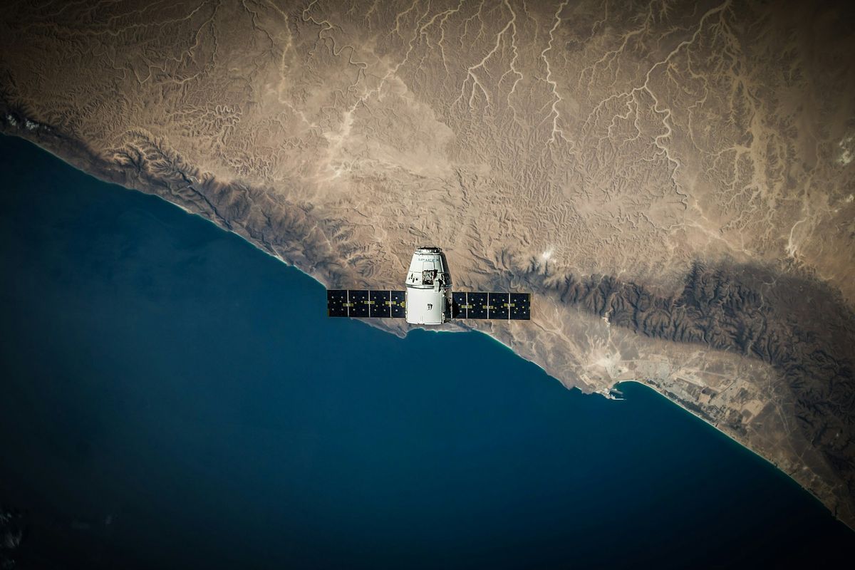 Satellite orbiting above a coastline seen from space